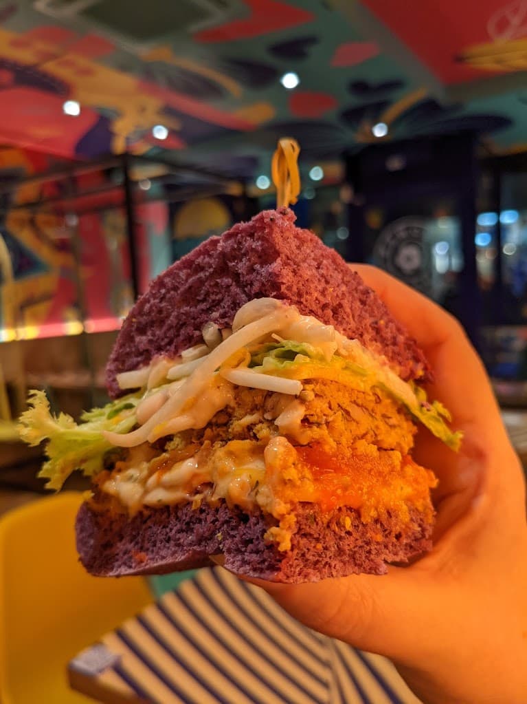 a purple bunned burger at flower burger brighton